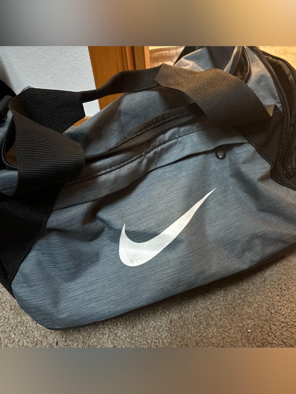 Nike Gray Duffel Bag with White Swoosh and Black Straps